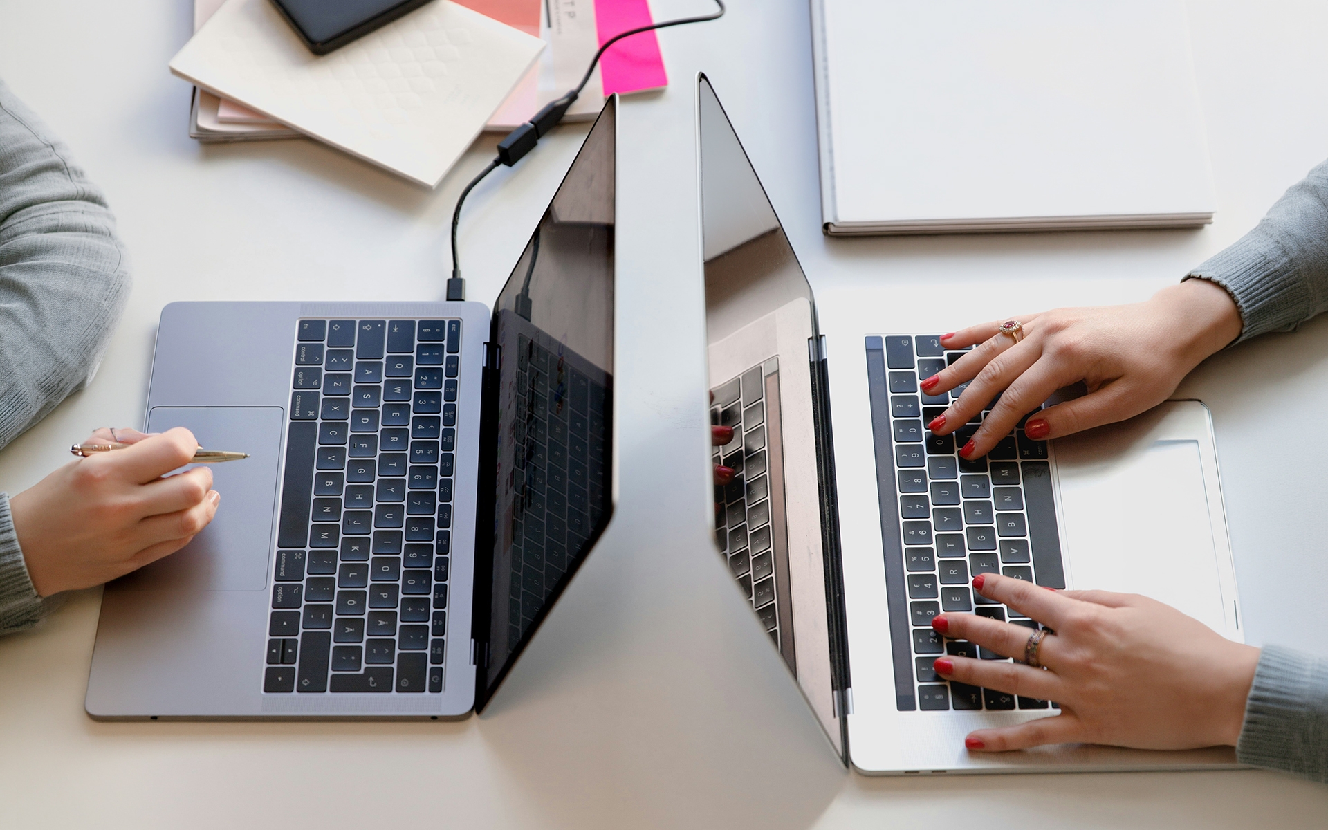 Detail Shot of 2 women working on their laptops